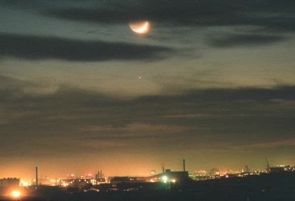 APOD: Moon Over Mongolia - February 9, 2002