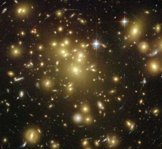 NASA APOD June 27, 2004: Galaxy Cluster Abell 1689 Warps Space