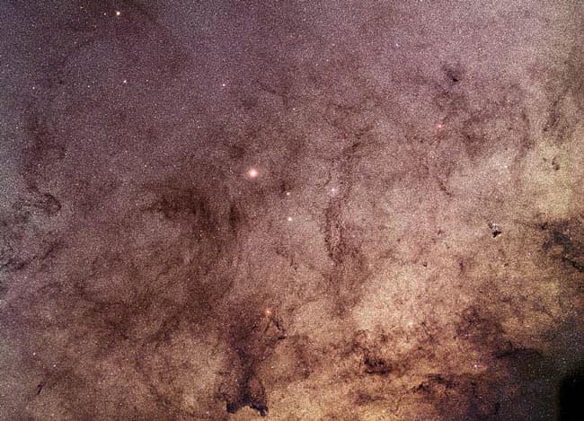 APOD: Stars and Dust Through Baade's Window - December 23, 2002