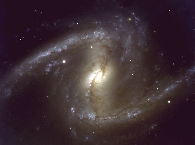 APOD: NGC 1365: A Nearby Barred Spiral Galaxy - April 13, 2003