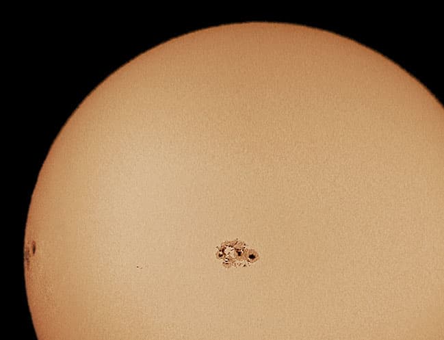 APOD: Large Sunspot Groups 10484 and 10486 - October 27, 2003
