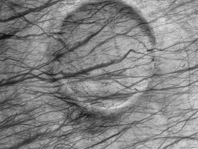 APOD: A Dust Devil Crater on Mars - December 30, 2003