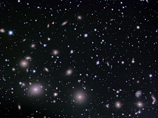 NASA APOD October 25, 2004: The Perseus Cluster of Galaxies