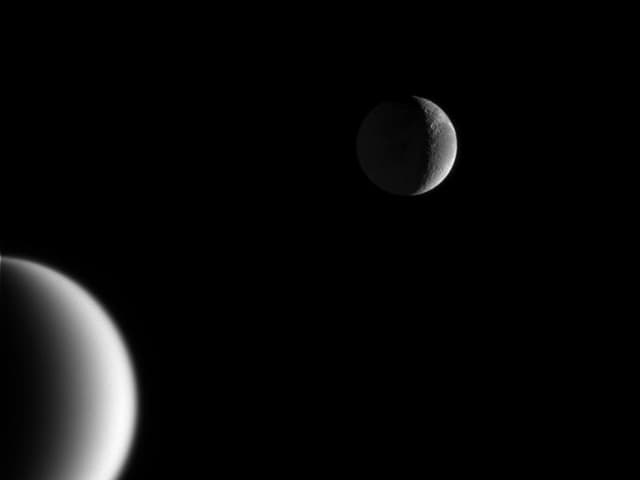 APOD: Crescents of Titan and Dione - March 29, 2005