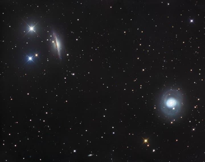 APOD: NGC 1055 and M77 - December 15, 2006