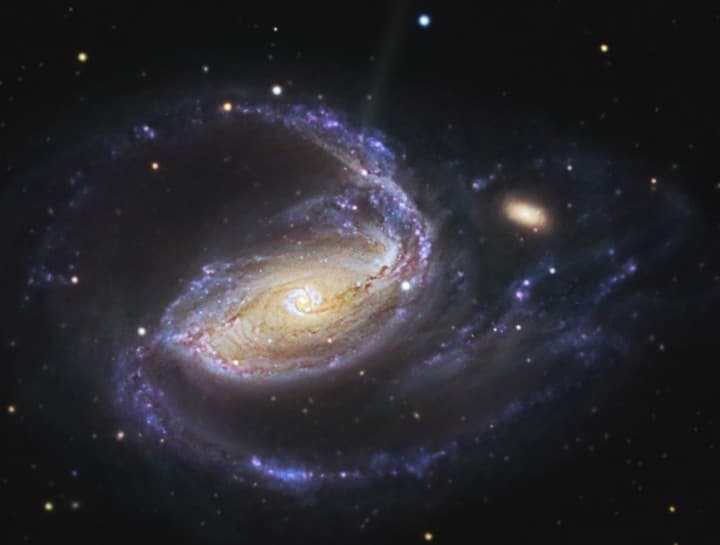 APOD: In the Arms of NGC 1097 - December 1, 2006
