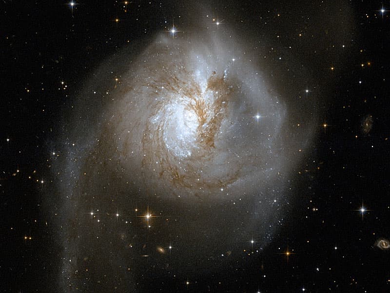 APOD: Galaxies Collide in NGC 3256 - May 6, 2008