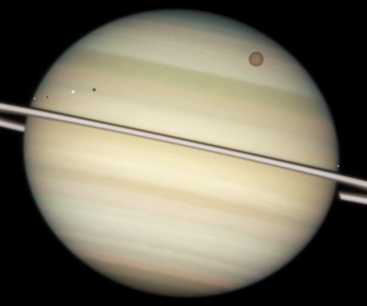 APOD: Saturn: Moons in Transit - March 19, 2009