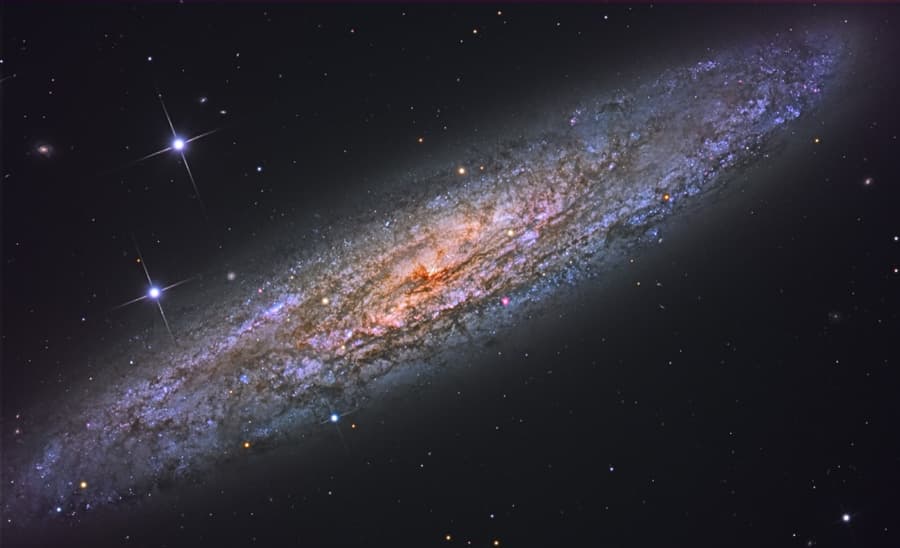 APOD: NGC 253: Dusty Island Universe - November 21, 2009