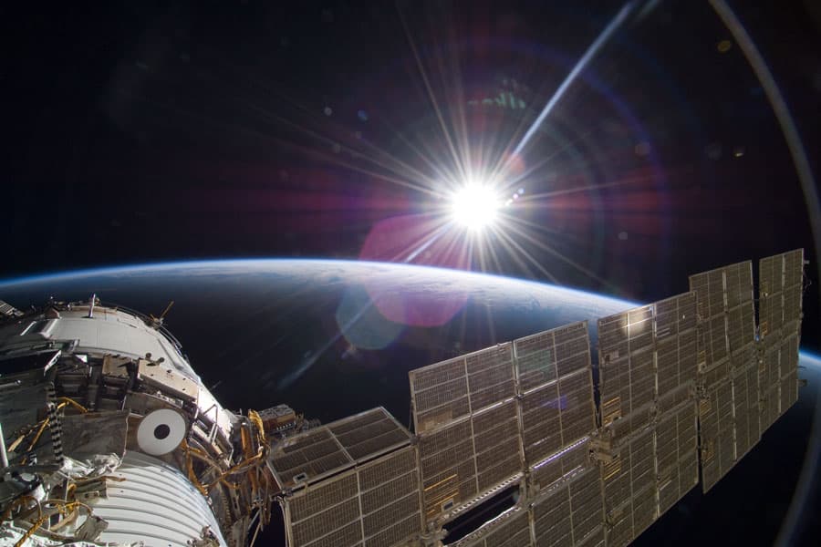 APOD: Bright Sun and Crescent Earth from the Space Station - November 30, 2009