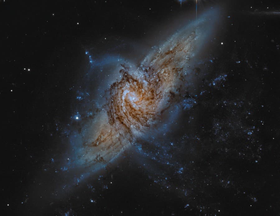 APOD: NGC 3314: When Galaxies Overlap - July 15, 2011