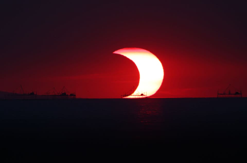 APOD: A Partial Eclipse Over Manila Bay - May 20, 2012