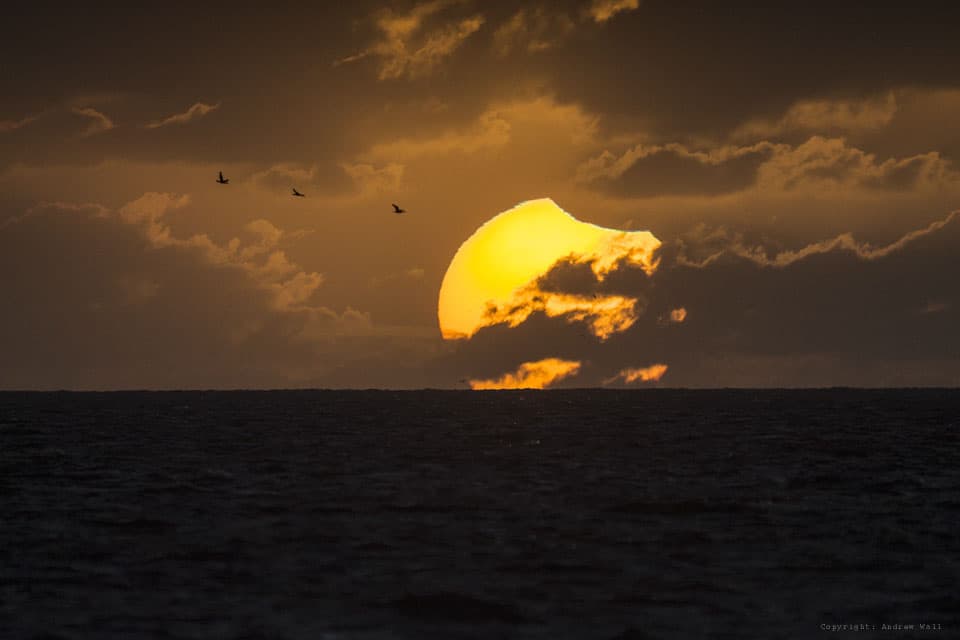 APOD: A Partially Eclipsed Setting Sun - April 30, 2014