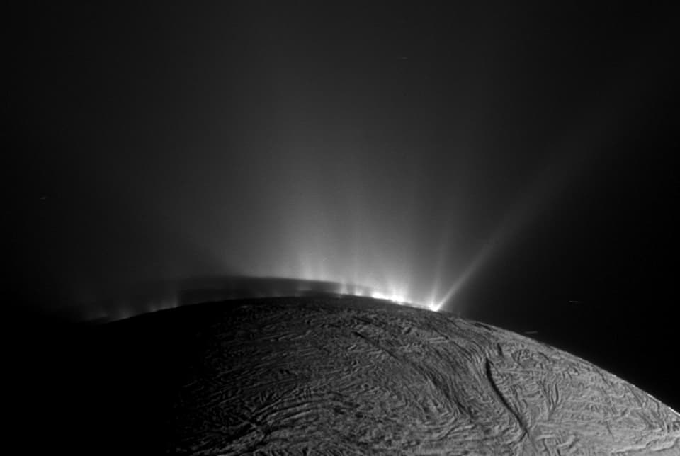 NASA APOD August 4, 2014: Shadows and Plumes Across Enceladus