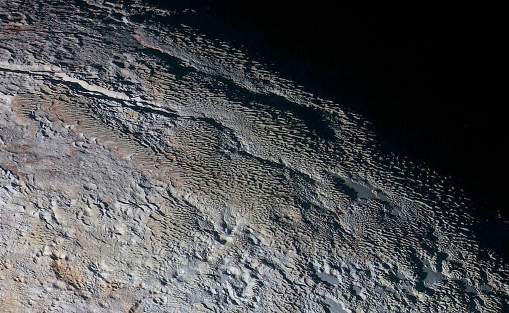 APOD: Pluto's Snakeskin Terrain - September 25, 2015