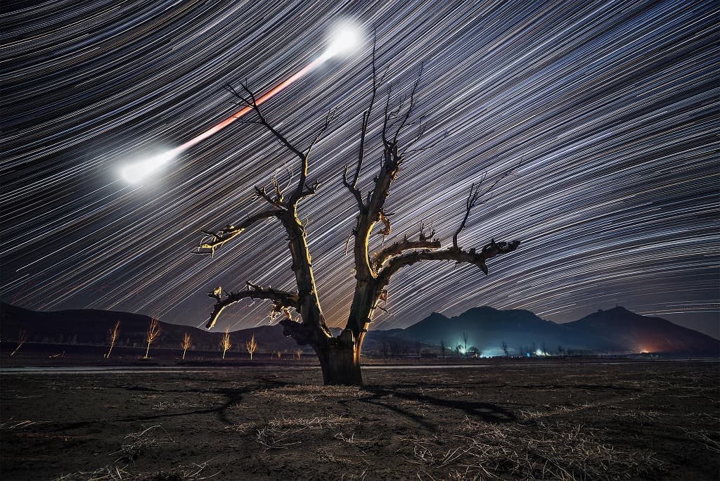 APOD: Bow Tie Moon and Star Trails - February 8, 2018