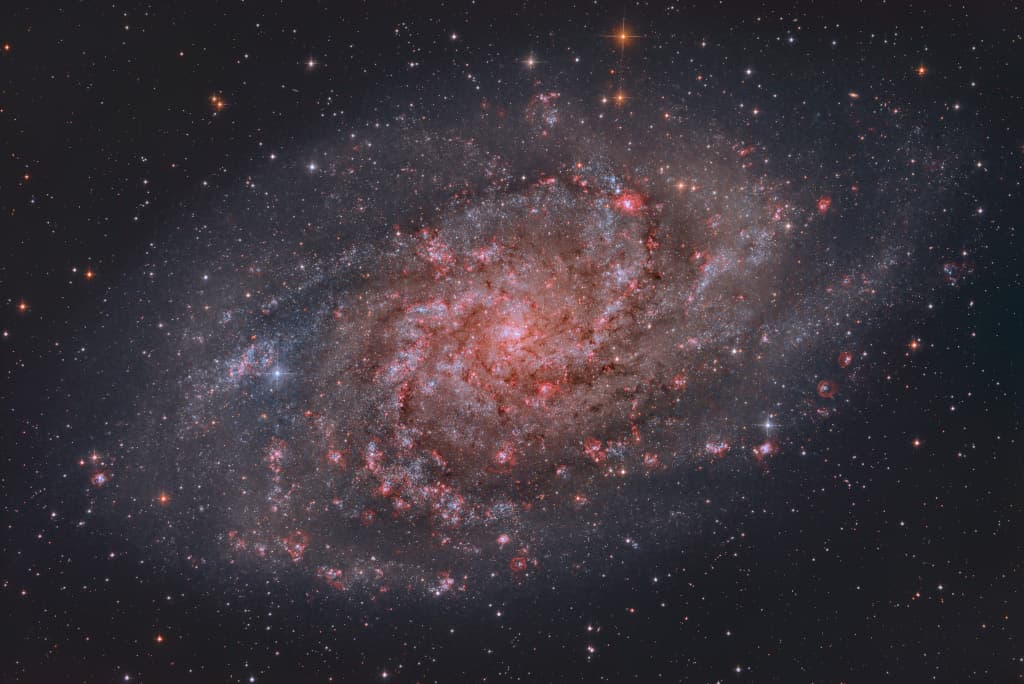 APOD: Hydrogen Clouds of M33 - October 13, 2023