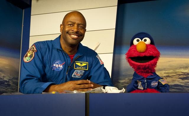 NASA image: Former Astronaut Leland Melvin speaks with Elmo