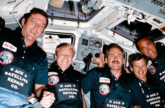 NASA image: Photo of 41-C crew taken in aft flight deck on orbit
