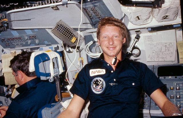NASA image: View of Mission specialist Steven Hawley on the flight deck