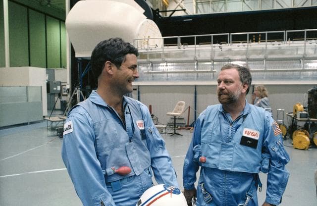 NASA image: Payload specialists Garneau and Scully-Power discuss training