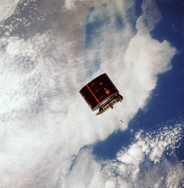NASA image: View of the Syncom IV satellite in orbit over the earth