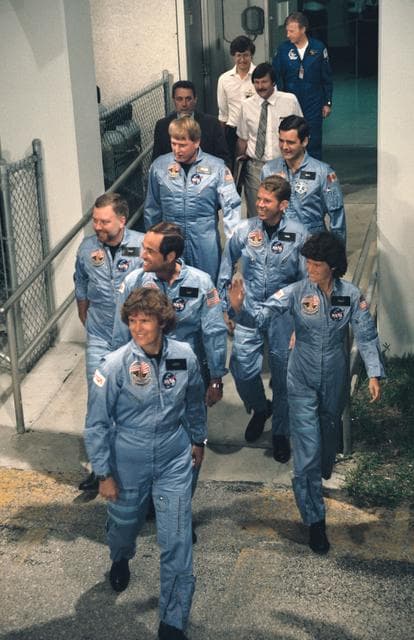 NASA image: STS 41-G crew prepares to leave Operations and checkout bldg for launch