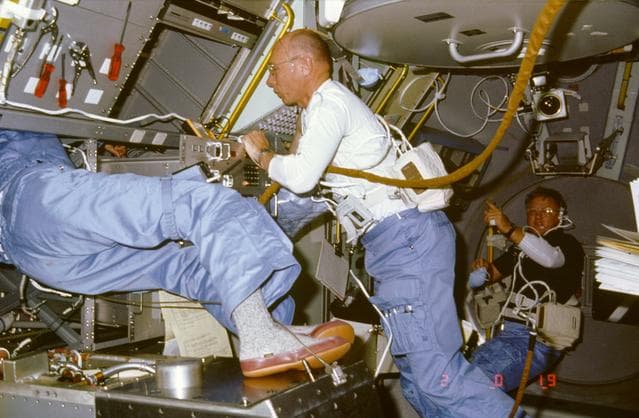 NASA image: Astronaut William Thornton helps crewmember performs repairs on DDM