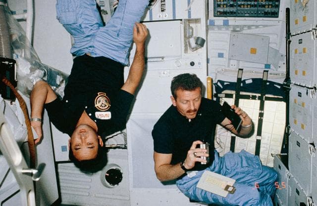 NASA image: Astronauts Onizuka and Shriver pose in middeck