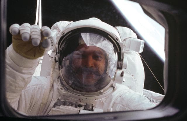 NASA image: Astronaut S. David Griggs waves to Orbiter during EVA