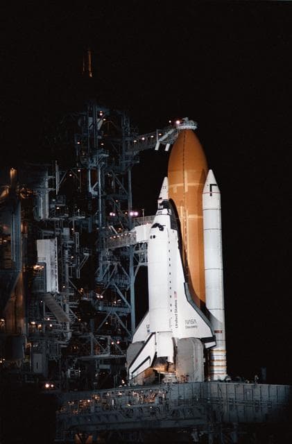 NASA image: View of the shuttle Discovery on the launch pad just prior to STS 51-D launch