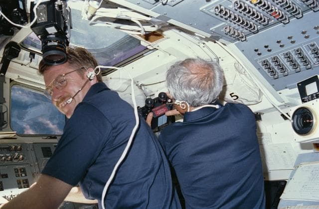 NASA image: Astronauts England and Bartoe working at aft fligh deck station