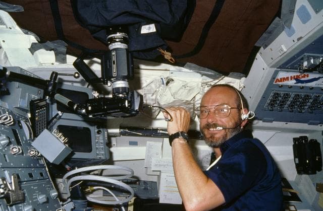NASA image: Payload specialist Loren Acton working at aft fligh deck station