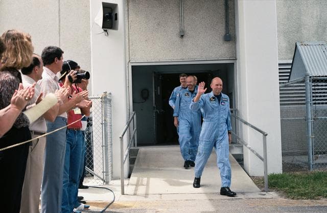 NASA image: STS 51-F crewmembers depart KSC's operations and checkout building
