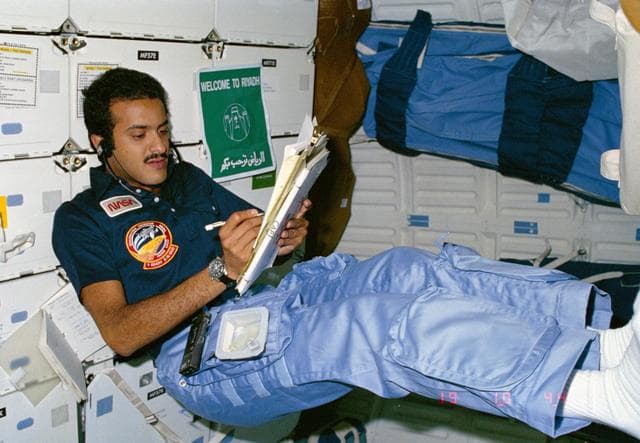 NASA image: Payload specialist Al-Saud siting in middeck area