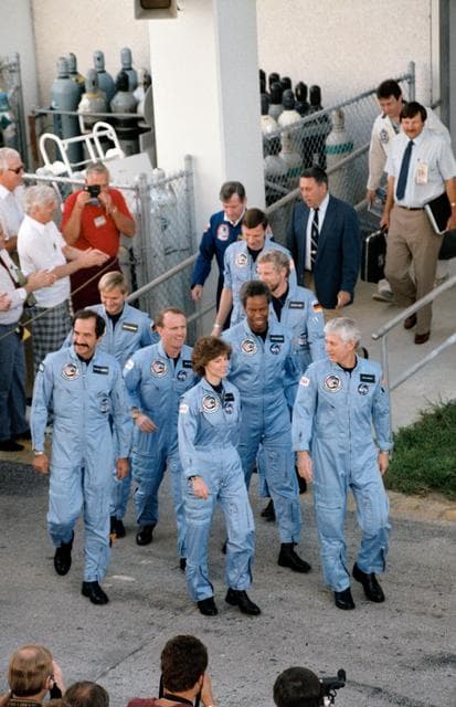 NASA image: STS 61-A crew leave operations & checkout facility for launch pad
