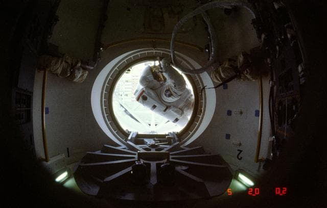 NASA image: Astronaut Jerry Ross at threshold of airlock compartment following EVA