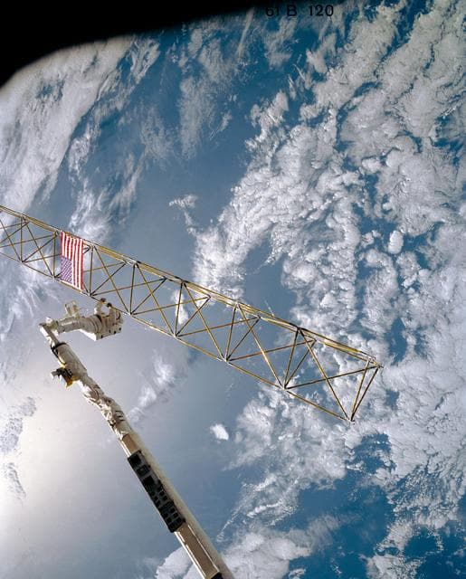NASA image: Astronaut Sherwood Spring on RMS checks joints on the ACCESS device
