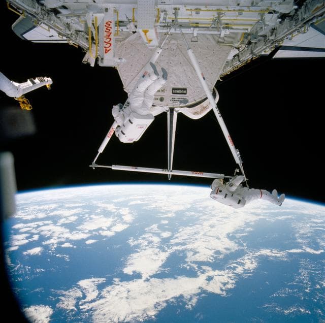 NASA image: Astronauts Jerry Ross and Sherwood Spring assemble ACCESS components