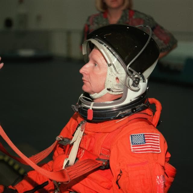 NASA image: STS-93 crewmembers engage in water survival training at the NBL
