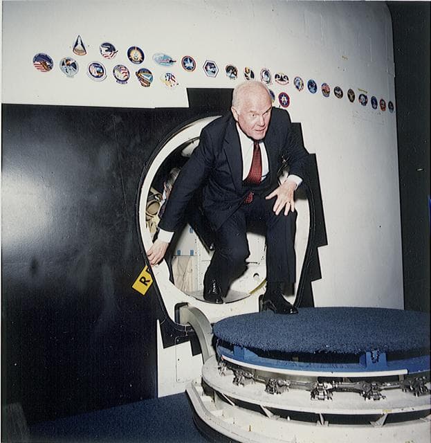 NASA image: Senator John Glenn egresses a Shuttle trainer during a tour