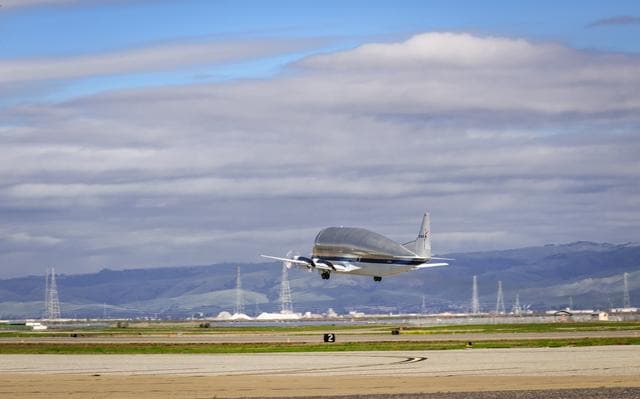 NASA image: NASAs B377SGT Super Guppy Turbine Cargo Airplane Leaving Moffett Field at NASA Ames.