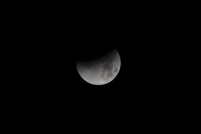 NASA image: NASA photographer captures Super Blue Blood Moon beginning its eclipse January 31 from NASA's Armstrong Flight Research Center on the West Coast.