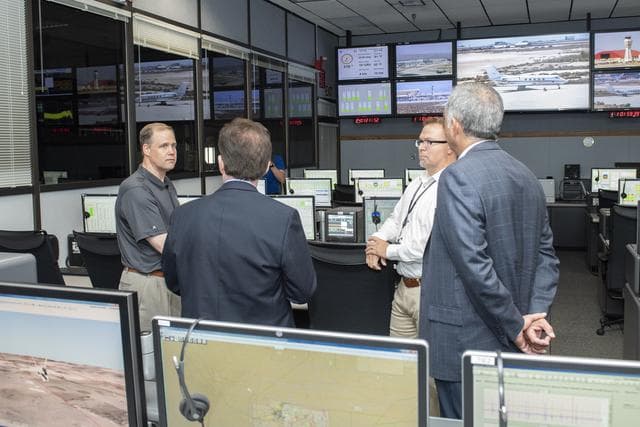 NASA image: Bridenstine stands by AFRC center director David McBride in one of Armstrong's mission control rooms that monitor flights, talk with pilots and gather data to project analysis.