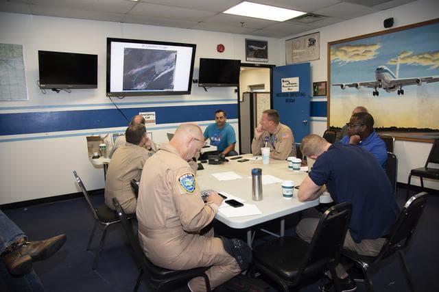 NASA image: NASA QSF18 Flight Operations Crew Debriefs Flight