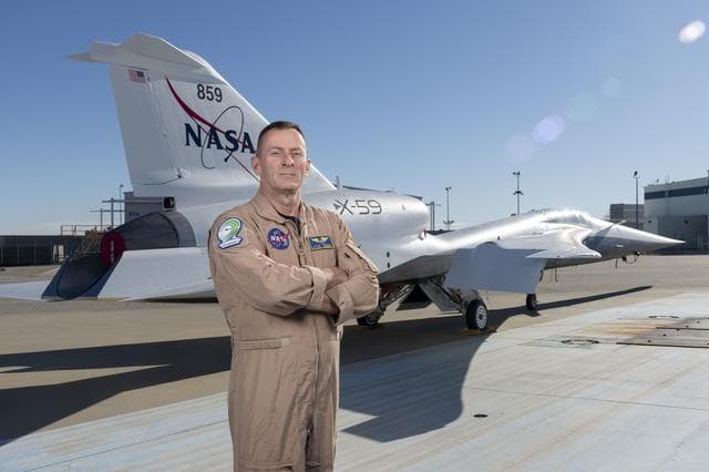 NASA image: NASA Test Pilot Jim Less Poses with X-59 Research Aircraft