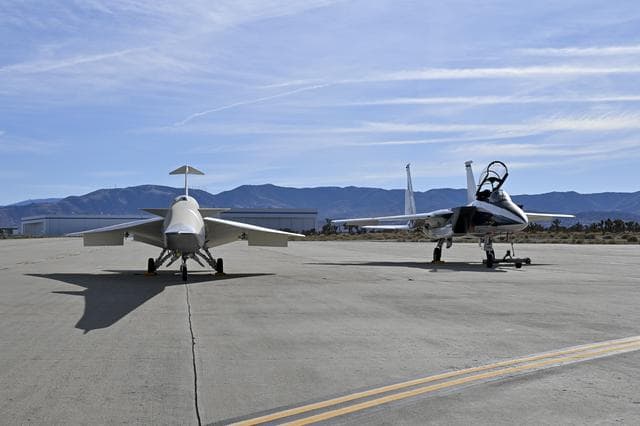 NASA’s F-15D research aircraft is positioned adjacent to the X-59 during electromagnetic compatibility testing at U.S. Air Force Plant 42 in Palmdale, California. Researchers activated the F-15D’s radar, C-band transponder, and radios at different dist