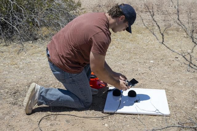 NASA image: NASA Intern Sets Up Ground Recording System Units