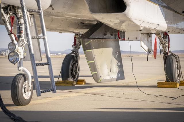 NASA image: NASA Wing Model Mounted Under F-15 for High-Speed Taxi Test