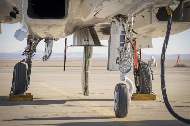 NASA image: NASA Wing Model Mounted Under F-15 for High-Speed Taxi Test